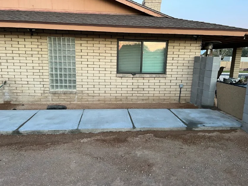 Concrete & flatwork. New concrete walkway along the house.